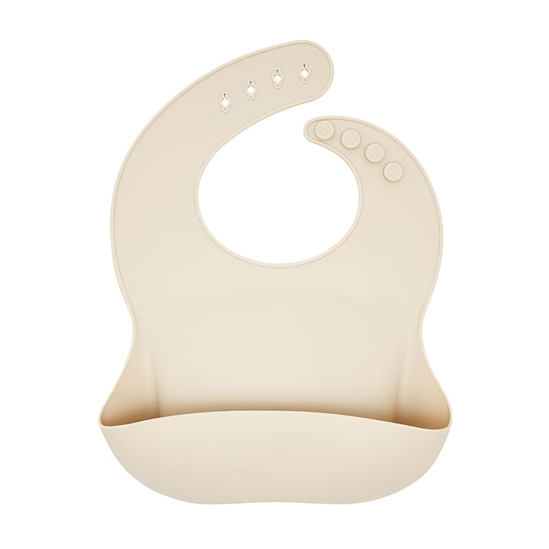 Babero beige silicona con bolsillo, atrapa restos y evita manchas. Little Hina Mimú bebés Jerez