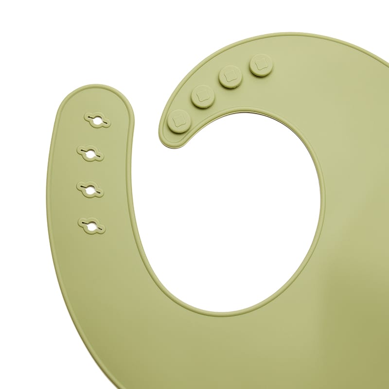 Babero silicona verde para papillas y frutas, práctico y seguro. Mimú bebés Jerez