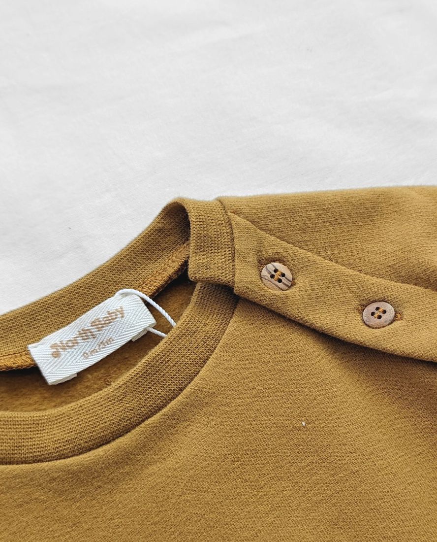 Mono orgánico curry, para pieles delicadas. Mimú bebés