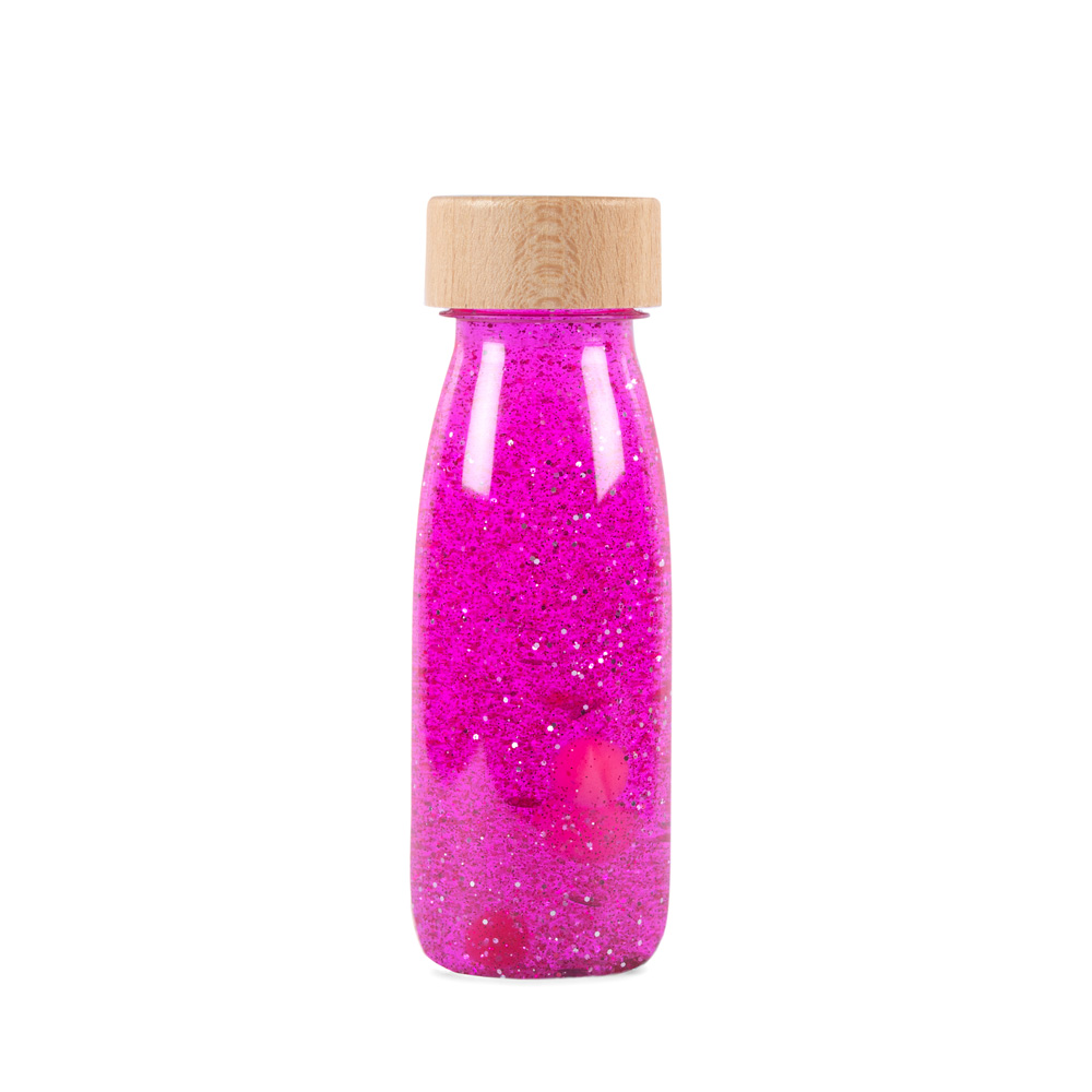 Botella sensorial float color rosa, con purpurina, líquido y elementos flotantes, ideal para relajación y concentración en bebés. Peti Boum en Mimú Jerez