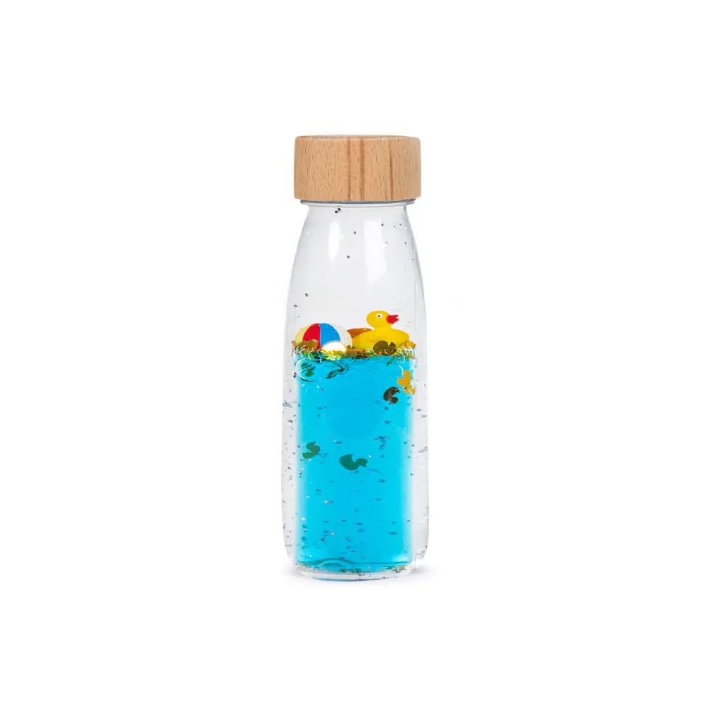 Botella sensorial move patito, con elementos flotantes, ideal juego tranquilo y concentración en bebés y niños y niñas. Petit Boum en Mimú